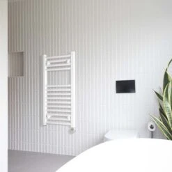 Ecostrad Fina-E Thermostatic Electric Towel Rail - White -Electric Radiators Direct fina e white angle 150w thermostatic lifestyle 1